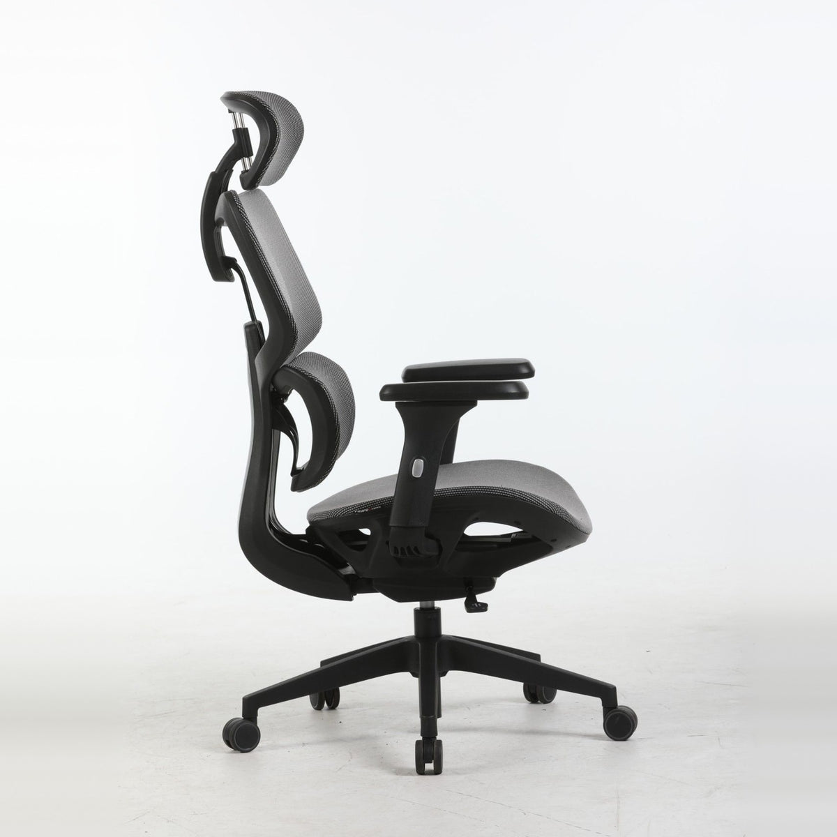 SILAS office chair in grey, side view showing the recline and lumbar support